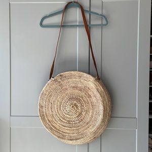 Woven round boho beach bag with leather strap